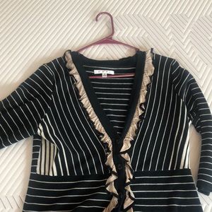 Black striped sweater with ruffles